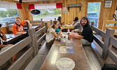 Sioux Lookout fantasy football league players and Ashley Stewart, Cam Stewart’ wife, showing their support to Stewart as he devours his mozza fries.    Angela Anderson / Bulletin Photo